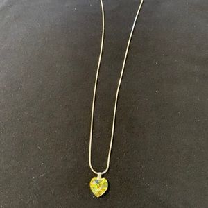 Crystal heart pendant with silver tone chain